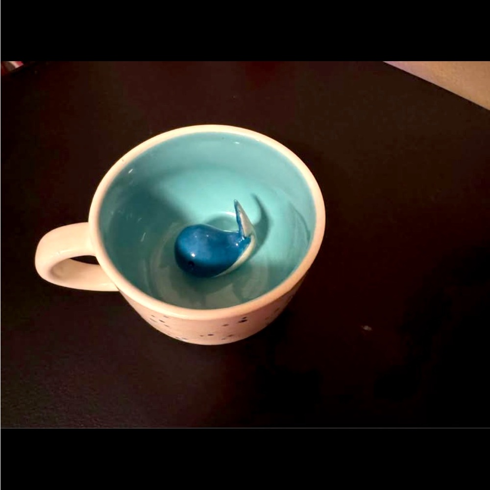 Coffee cup with hidden whale